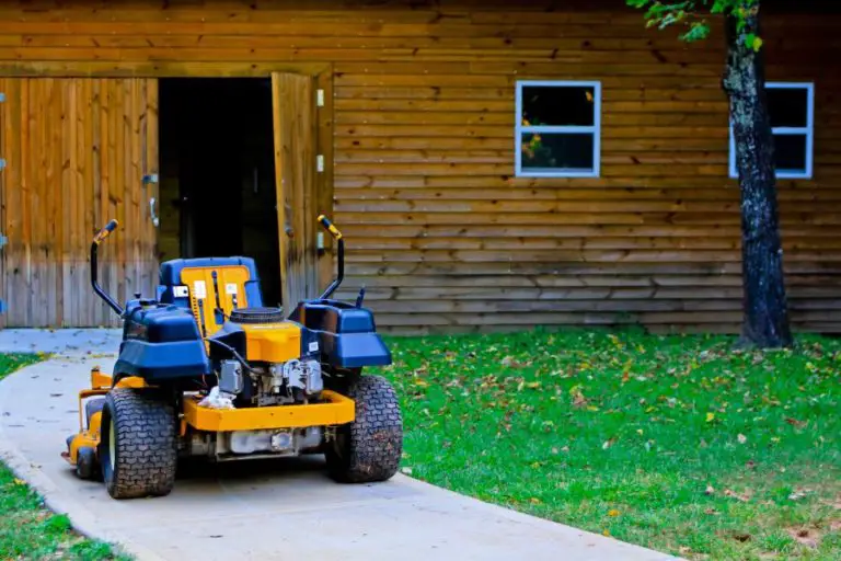 a zero turn mower sits in front of a home