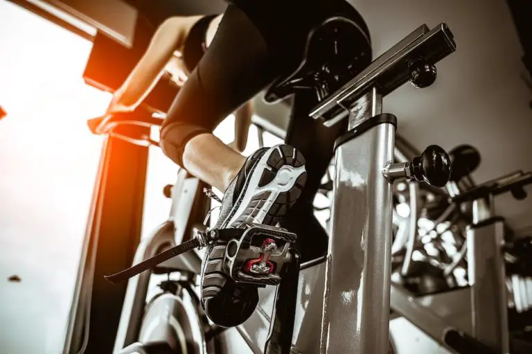 woman using ab indoor cycling bike