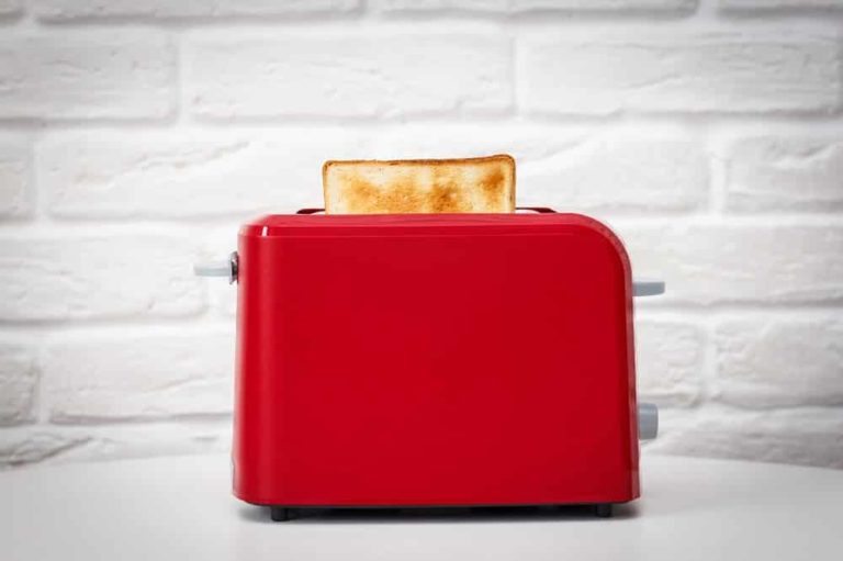 a cuisinart toaster with a piece of freshly toasted bread in it