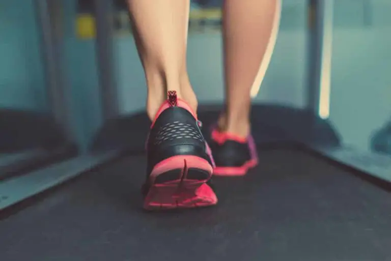 person walking on a slim tread treadmill