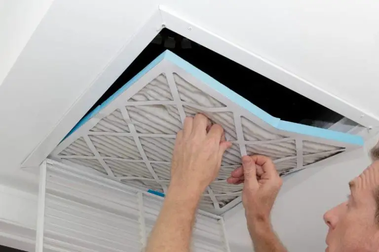 man installing an 18x20x1 air filter