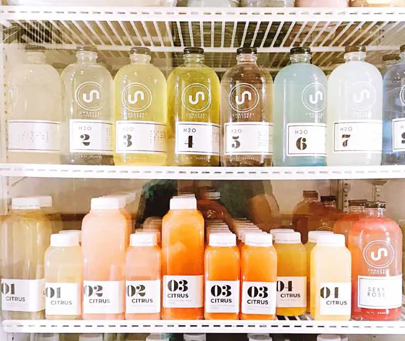 A wide arrange of citrus drinks in the fridge 