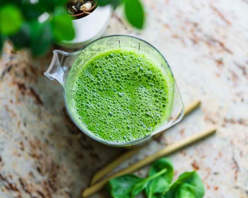 A pitcher with a fresh batch of green juice