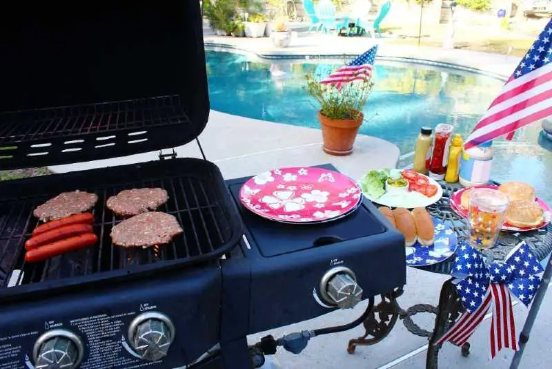 A gas grill with an extra burner 