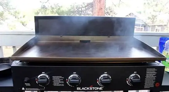 Vegetable oil sizzling on a griddle's surface 