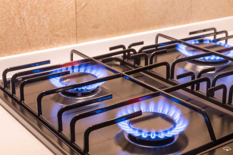 Pro-style gas range burners in action 