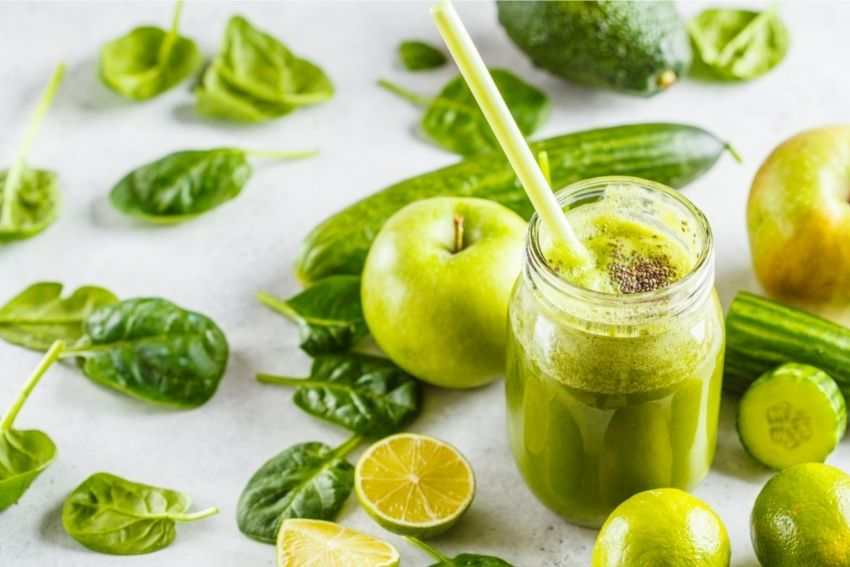 Some greens and a jar of freshly-squeezed green juice 