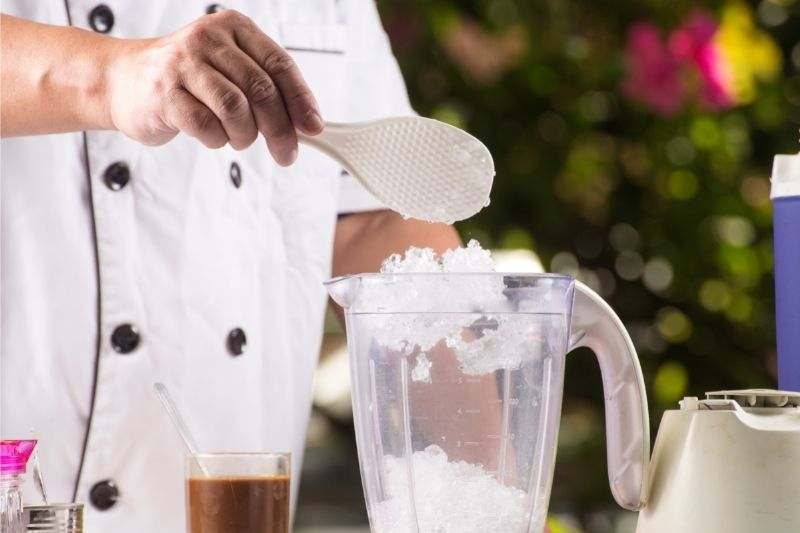 A chef preparing a frozen drink