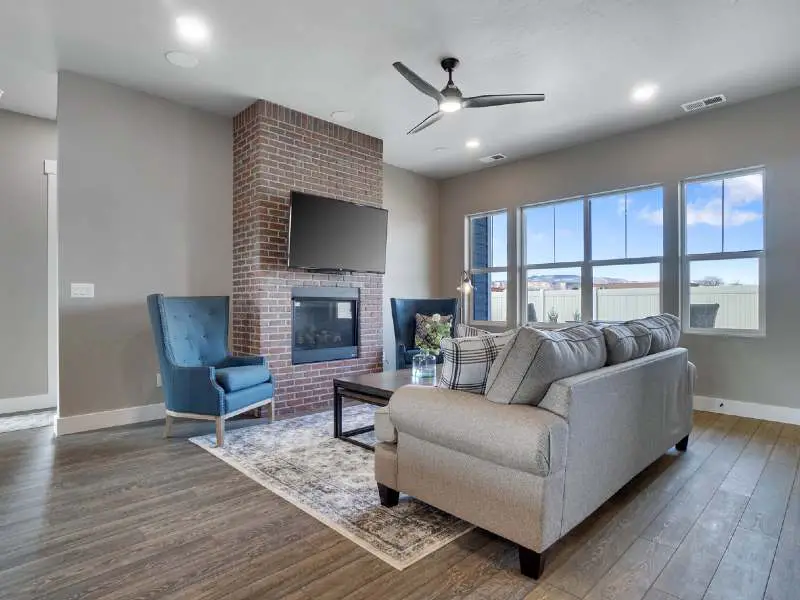 Modern minimalist apartment with a ceiling fan 