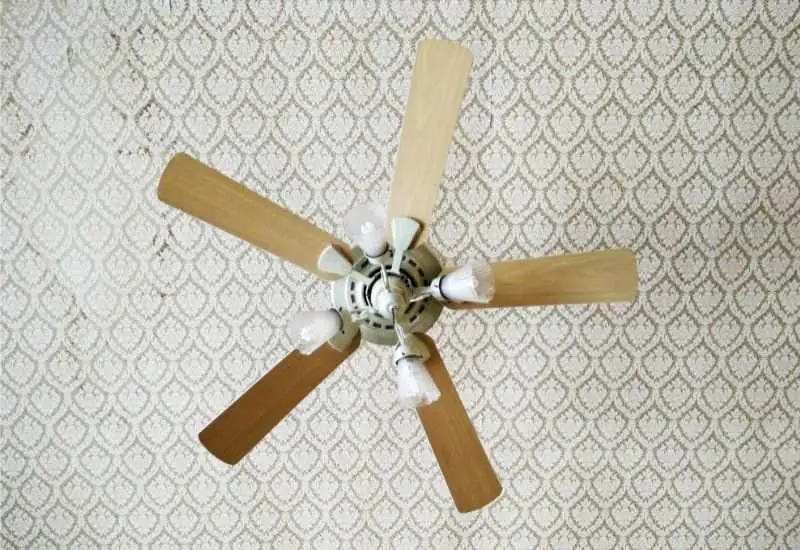 An old-fashioned 5-blade ceiling fan 