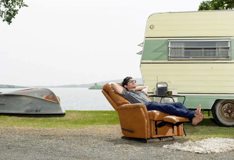 A man relaxing in his Lazy Boy recliner outside 