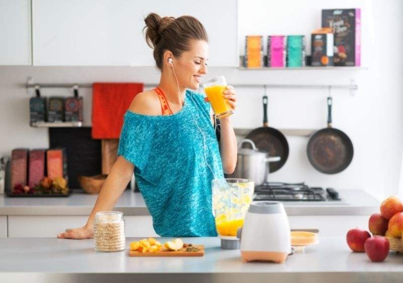 A girl enjoying a fresh glass of juice 