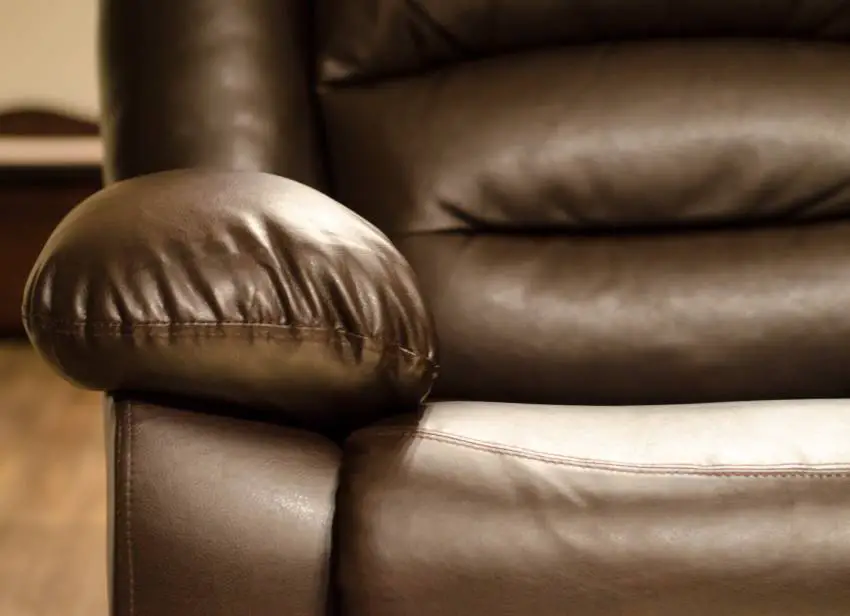 A close up of a leather recliner's armrest 