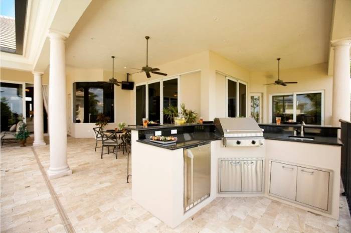 3 modern looking outdoor ceiling fans installed in a yard kitchen 