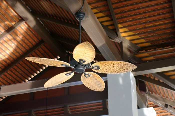 Artistic looking ceiling fan hanging from a ceiling 