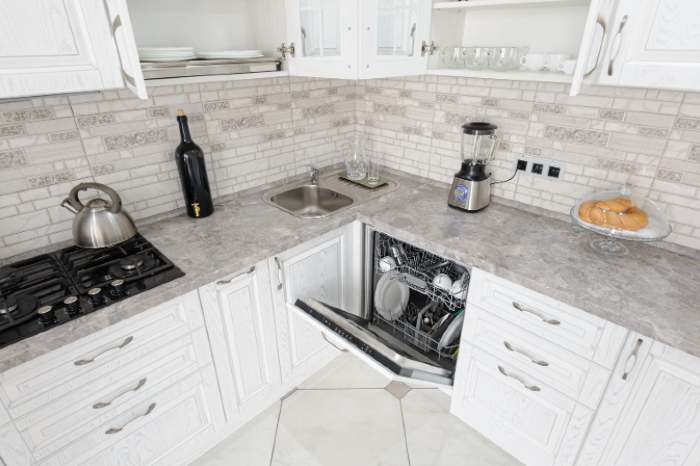 A modern kitchen with a dishwasher and a blender 