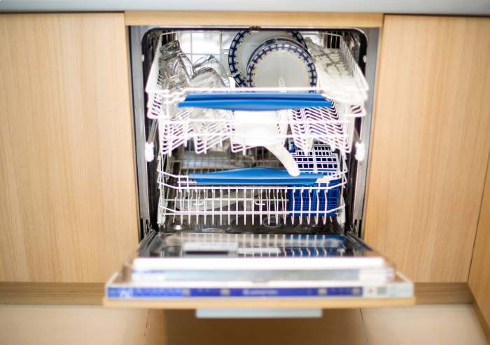 A dishwasher full of various dishes 